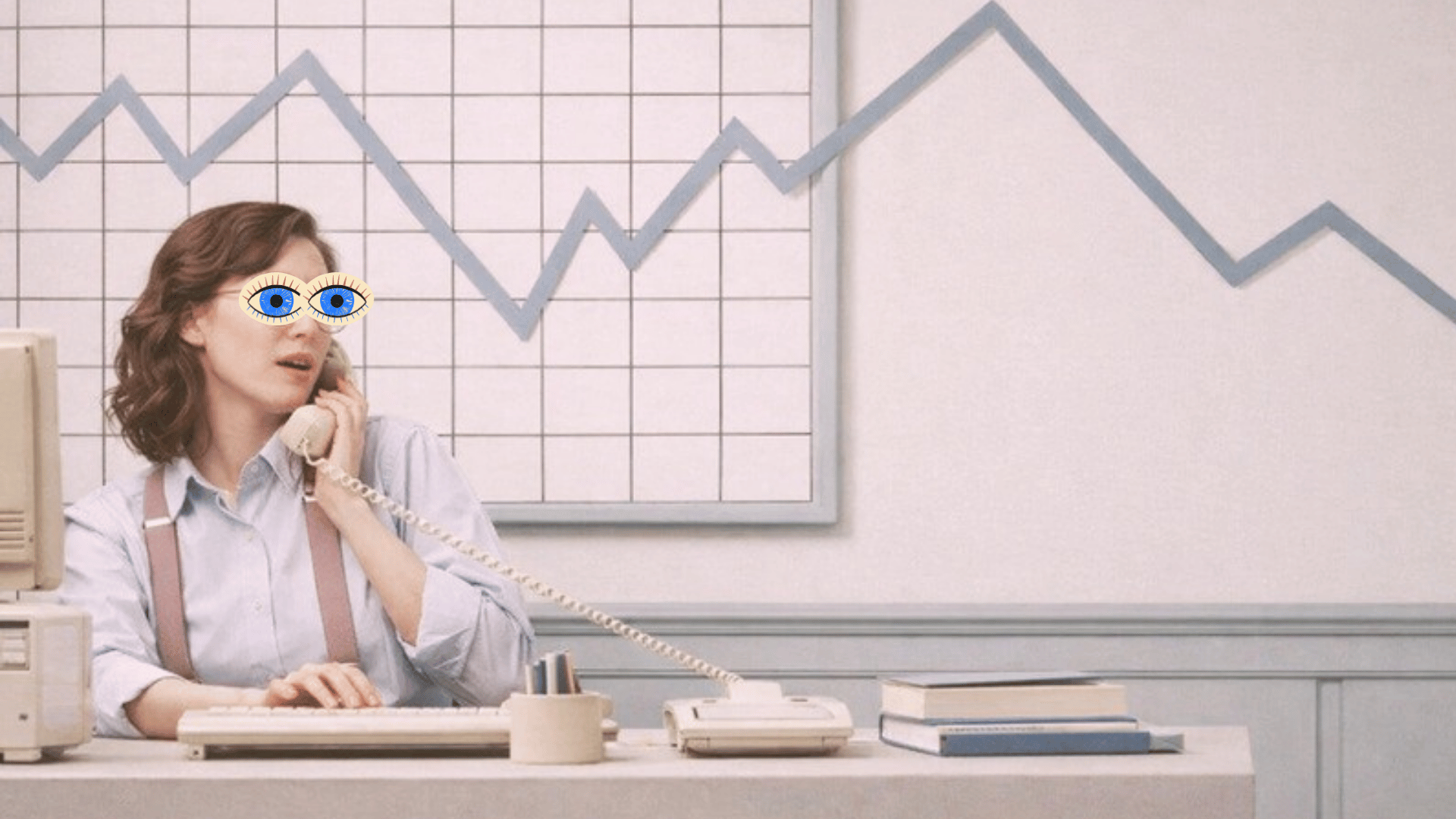 A woman at a retro computer talks on the phone under a falling chart line, with a pair of eyes drawn over her own eyes